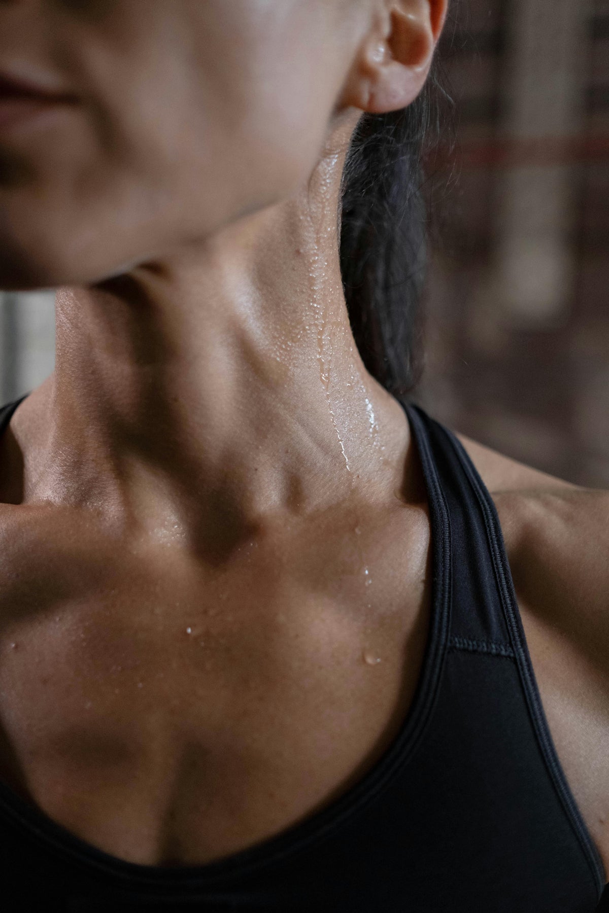 Close up of athlete sweating during workout representing athletic recovery