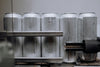 Aluminum cans on a production line representing hydrogen water can technology
