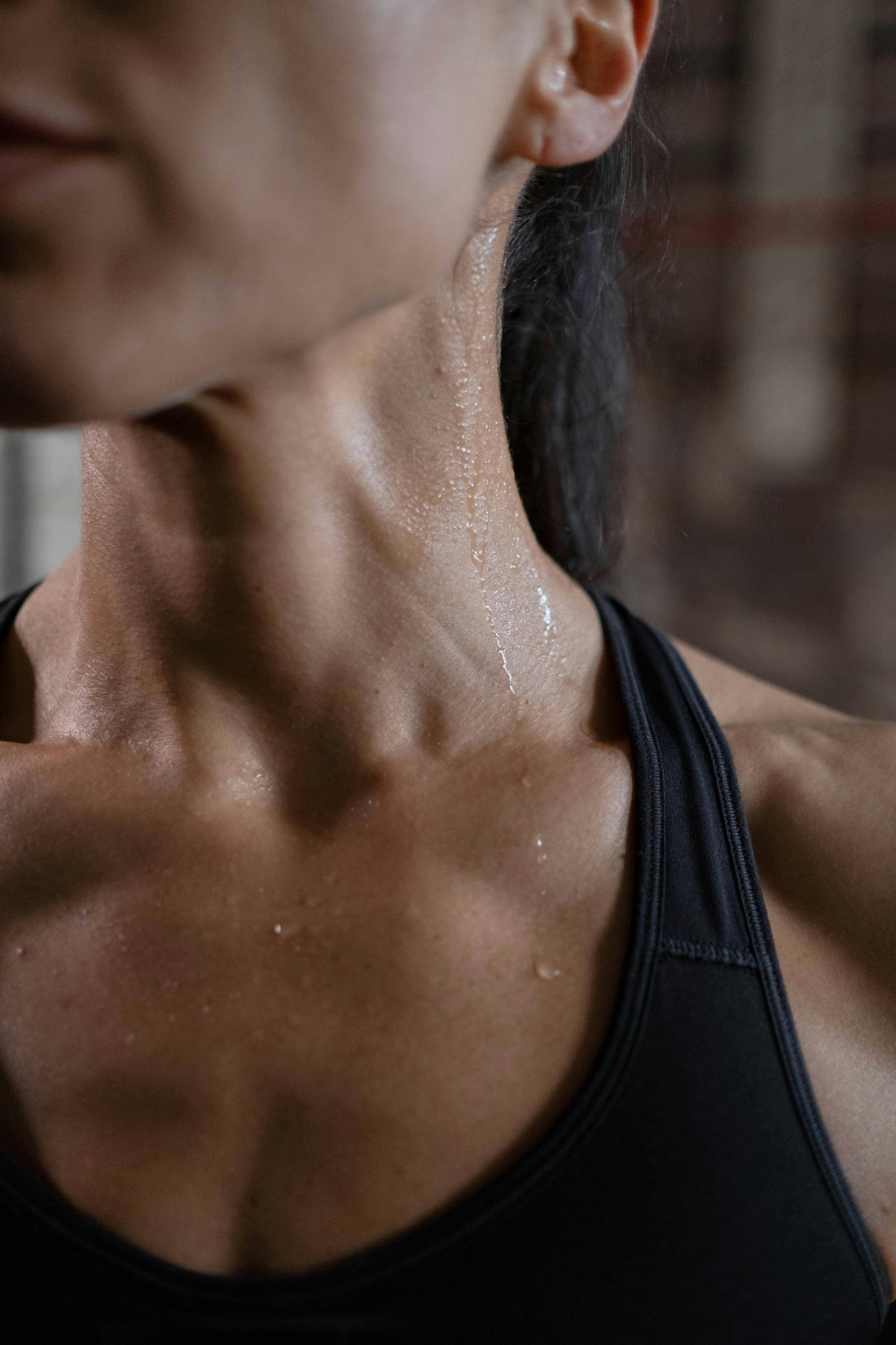 Close up of athlete sweating during workout representing athletic recovery